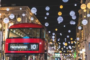 Red double decker bus in London during Christmas time.