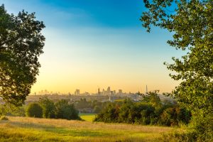The City of London Cityscape at Sunrise with early Morning Mist from Hampstead Heath. Buildings include the Shard, Gherkin 30 St Mary Axe, St Pauls, Lloyds Building, Stock Exchange and Walkie Talkie.