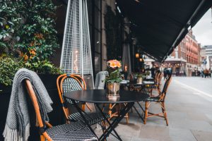 Marylebone outdoor coffee and restaurant terrace with tables, chairs and outdoor heater. CommercialPest Control.