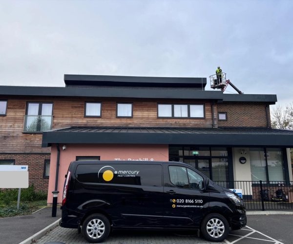 Mercury pest control van outside a commercial site